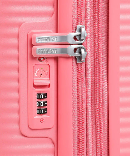 American Tourister Soundbox 4-Rollen Trolley sun kissed coral